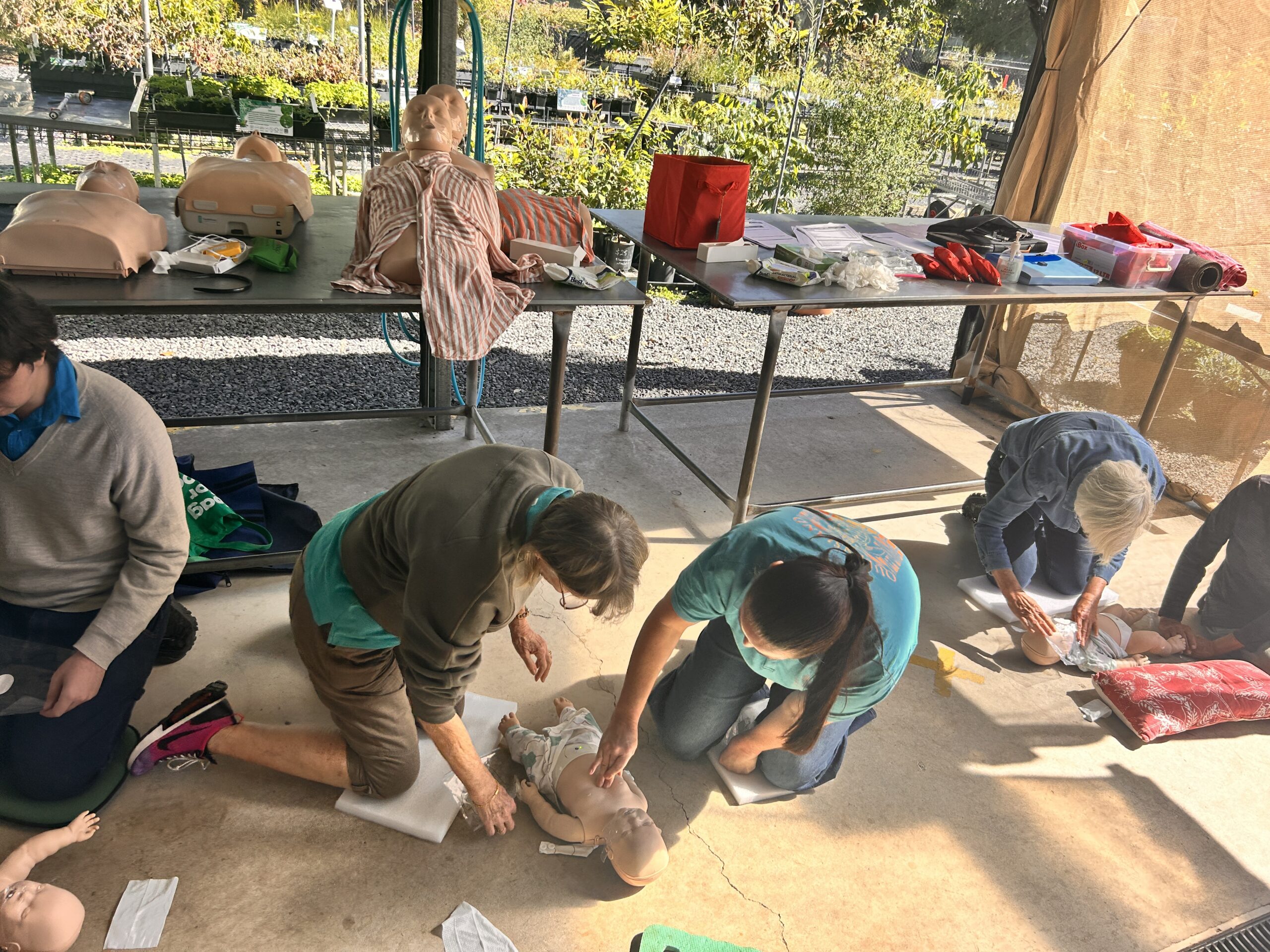 Employees taking part in group CPR and first aid training at Horizon Training, learning life-saving skills and workplace safety techniques.”